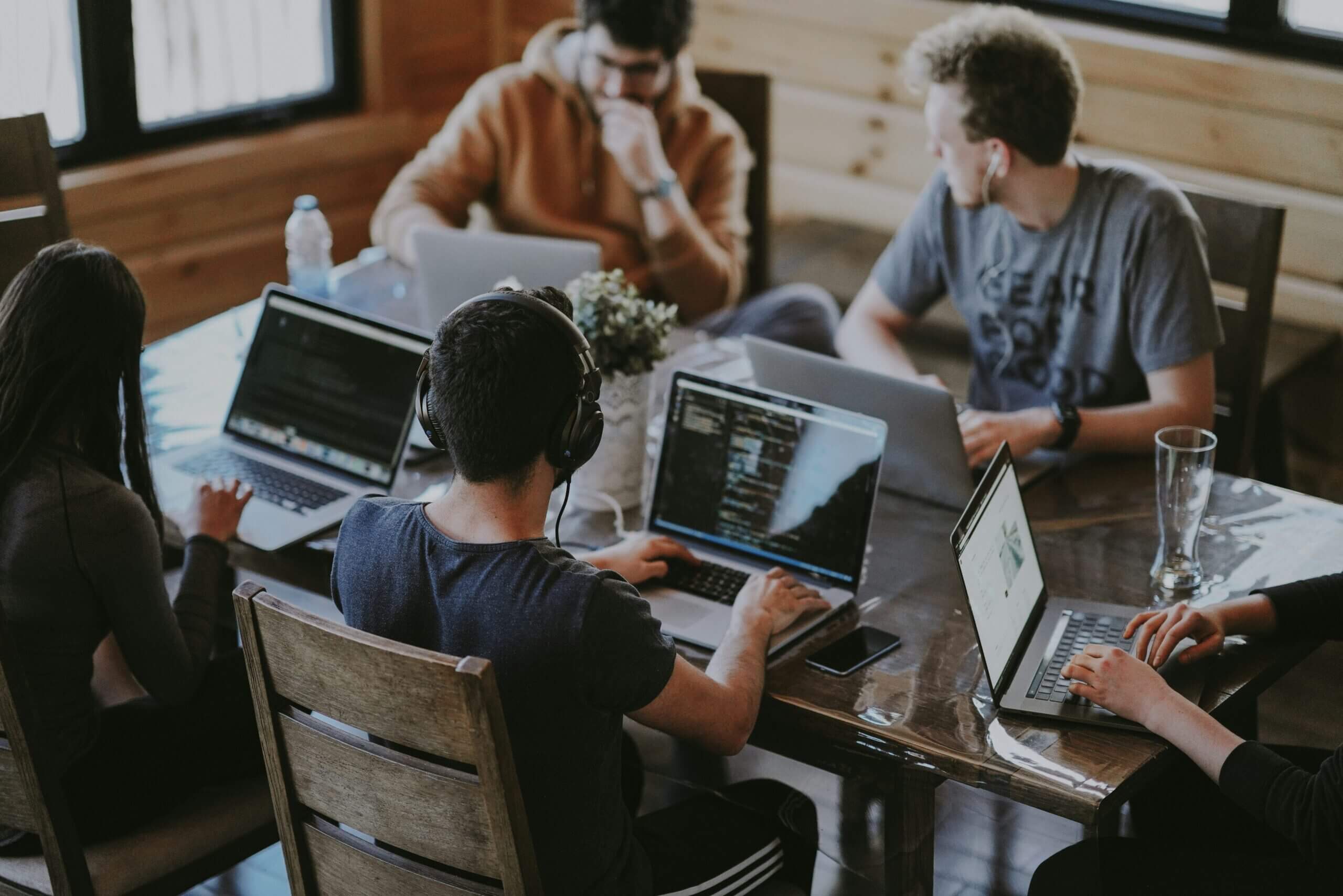 group of people using a laptop